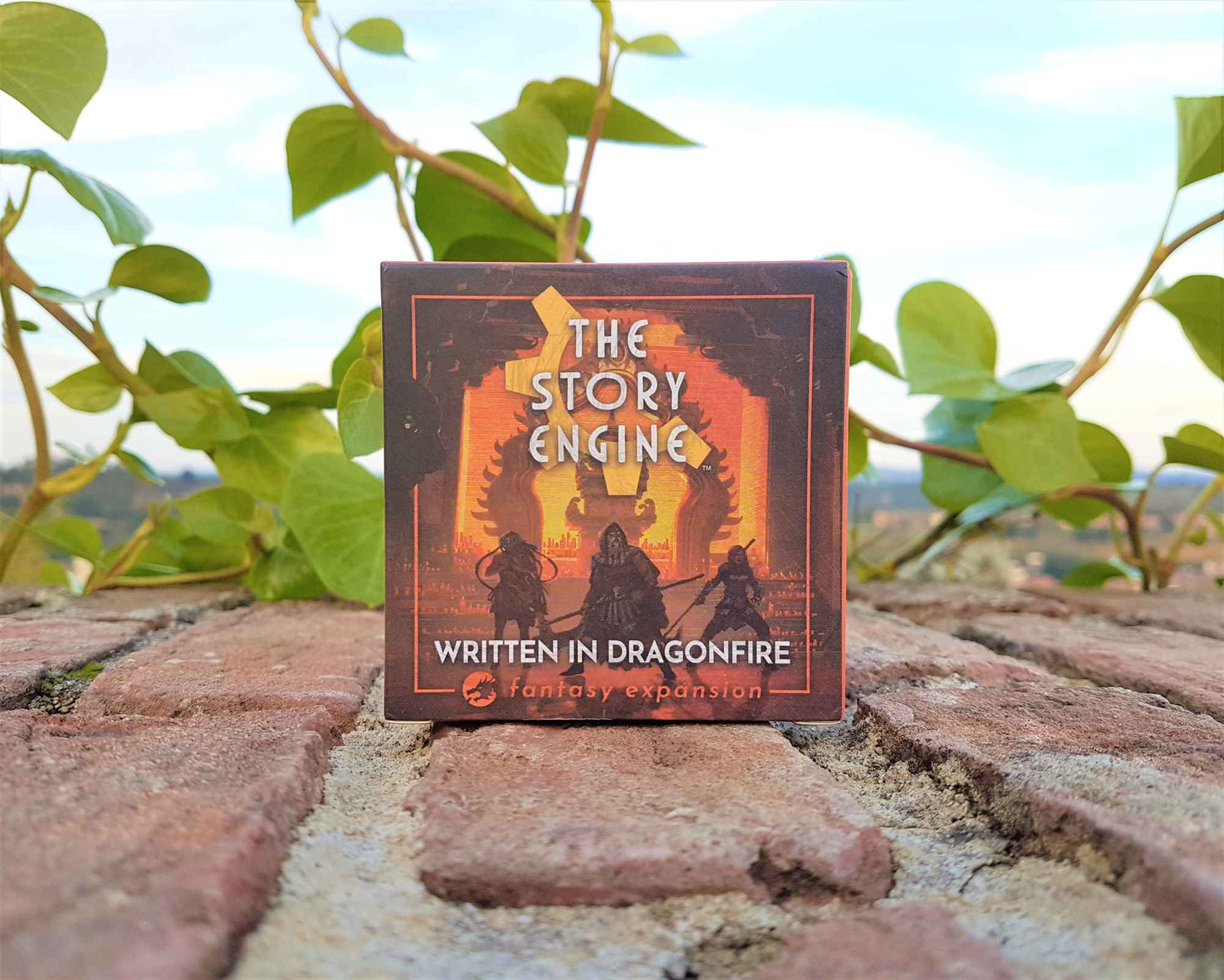 Story Engine Fantasy Writing Prompts box on brick walk with vines