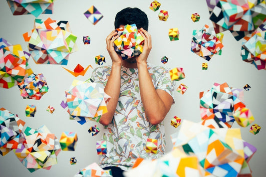 Colourful shapes surrounding person