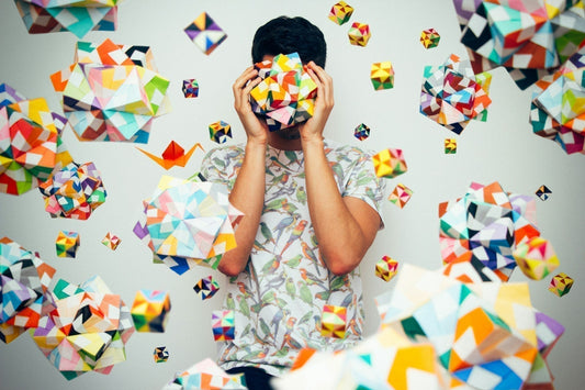 Colourful shapes surrounding person