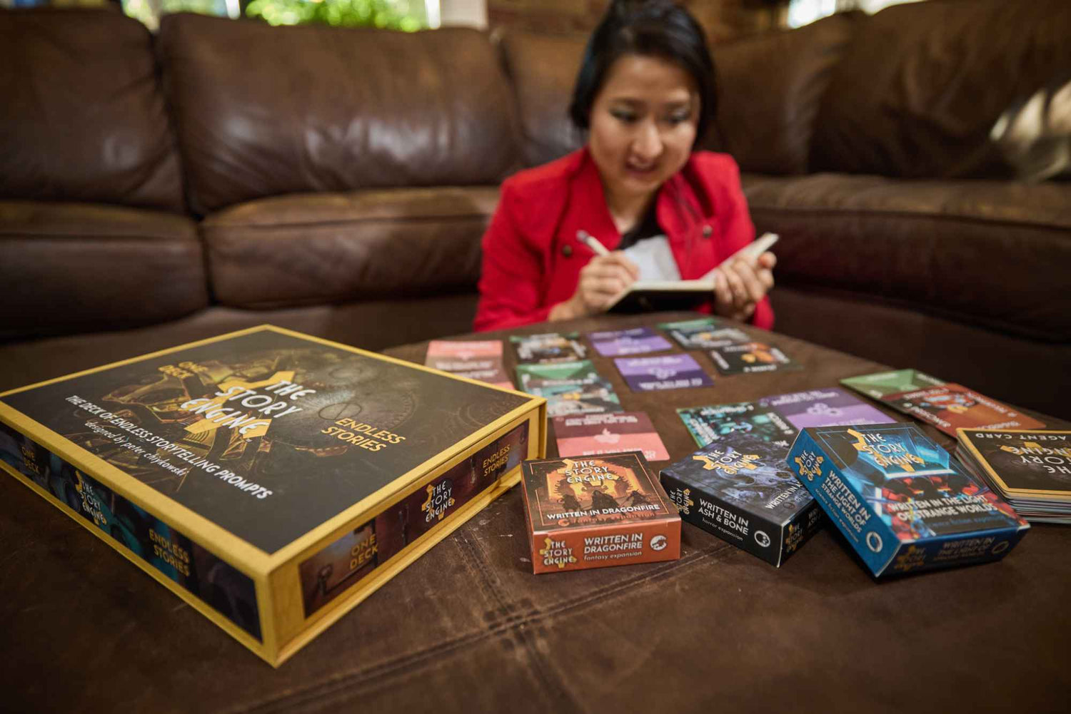 Writer using The Story Engine Deck and starter expansions to write